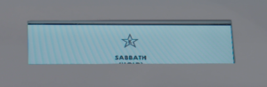 A rectangular display shows a star icon above the word "SABBATH" on a light blue background.