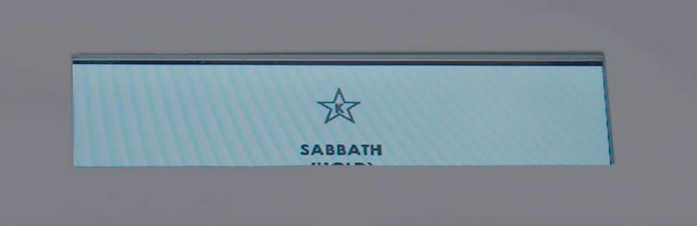A rectangular display shows a star icon above the word "SABBATH" on a light blue background.