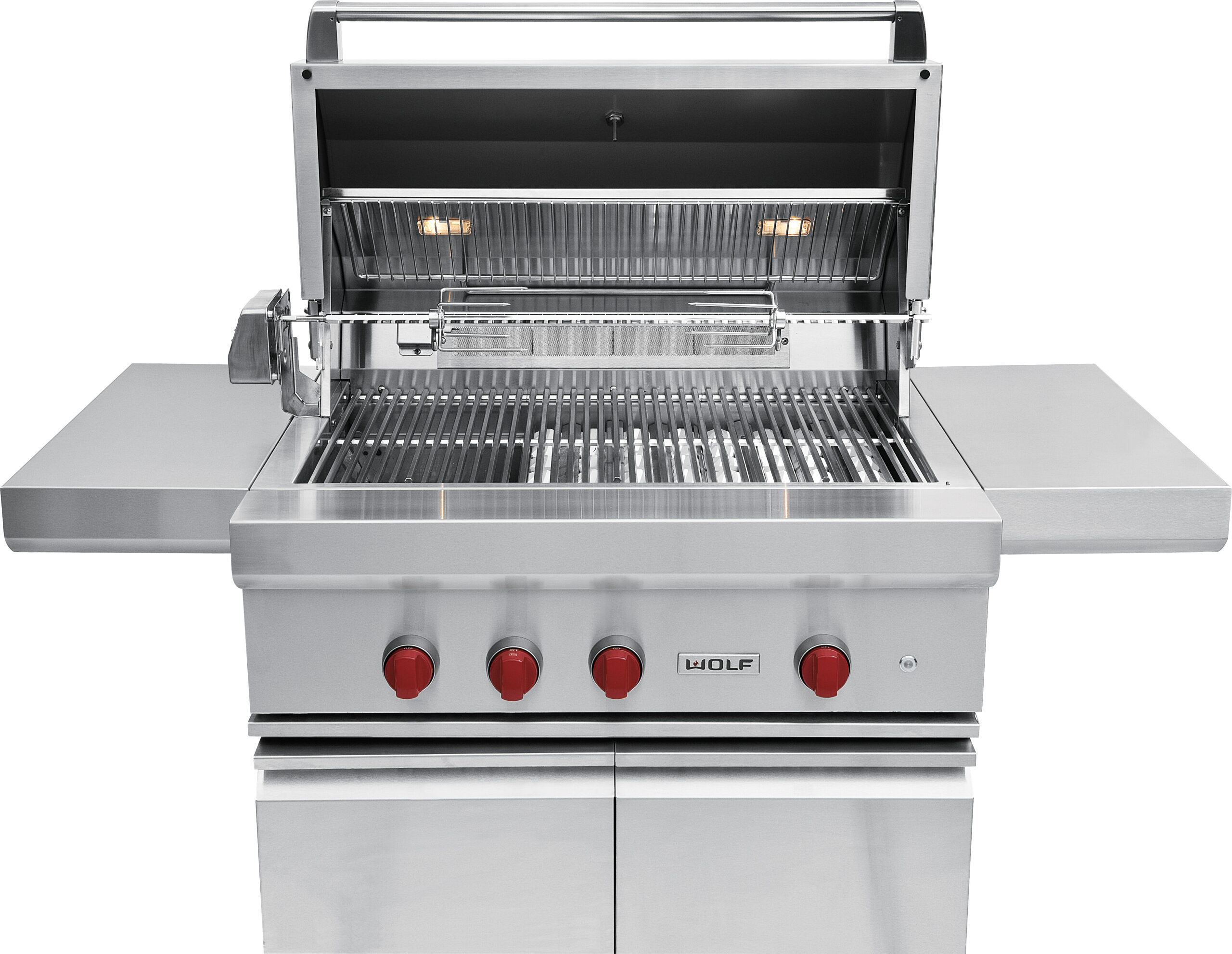 A stainless steel outdoor gas grill with four red control knobs, an open hood, side shelves, and internal lights.
